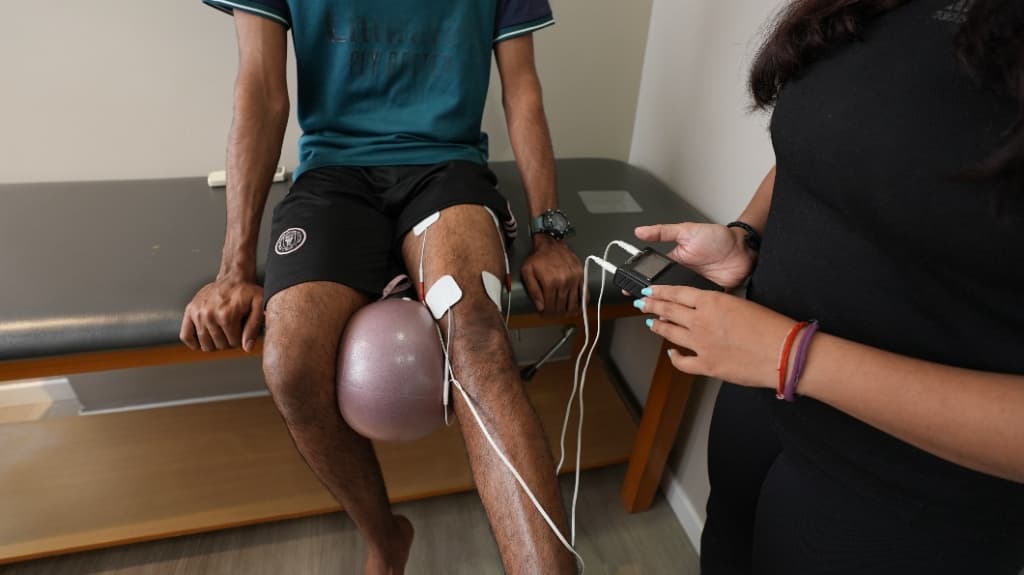 Neuromuscular electrical muscle stimulation (EMS/NMES) for quadriceps activation and knee rehabilitation at Zen Physiotherapy Clinic Nashik